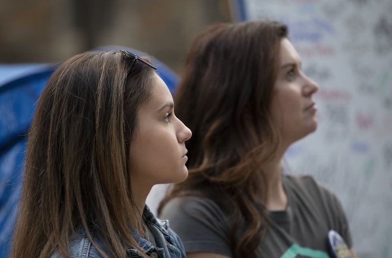  Kaylee Lorincz and Larissa Boyce, survivors of sexual abuse by Nassar, at the vigil in Michigan. Getty / AFP
