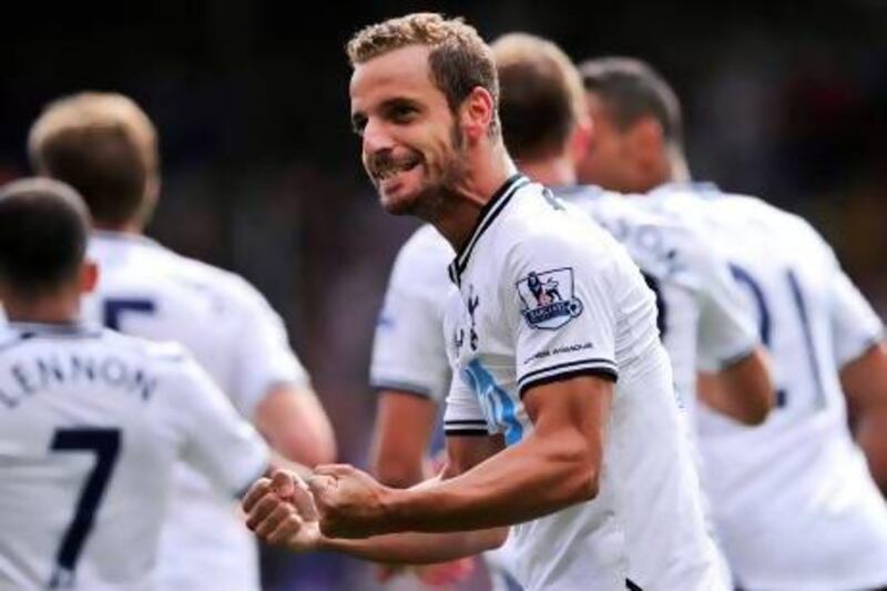 Tottenham Hotspur's Spanish striker Roberto Soldado celebrates after scoring a penalty for the opening goal during their English Premier League football match against Tottenham Hotspur at Selhurst Park in London on August 18, 2013. Tottenham won 1-0. AFP PHOTO/GLYN KIRK 

== RESTRICTED TO EDITORIAL USE. NO USE WITH UNAUTHORIZED AUDIO, VIDEO, DATA, FIXTURE LISTS, CLUB/LEAGUE LOGOS OR ìLIVEî SERVICES. ONLINE IN-MATCH USE LIMITED TO 45 IMAGES, NO VIDEO EMULATION. NO USE IN BETTING, GAMES OR SINGLE CLUB/LEAGUE/PLAYER PUBLICATIONS.
 *** Local Caption *** 762464-01-08.jpg