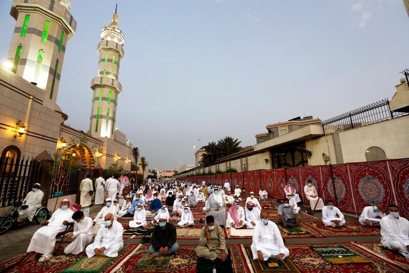 Masks and physical distancing evident as Muslims perform an Eid Al Fitr prayer marking the end of Ramadan in Jeddah. AP Photo
