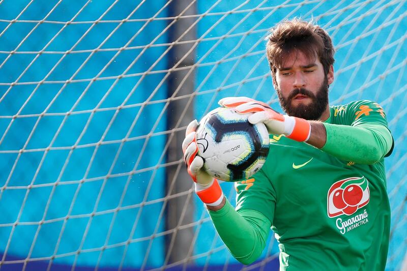 Brazil goalkeeper Alisson takes part in a training drill. Reuters