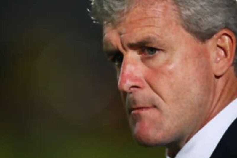 The Manchester City manager Mark Hughes' multi-million pound team suffered an embarrassing League Cup second round exit to Brighton.