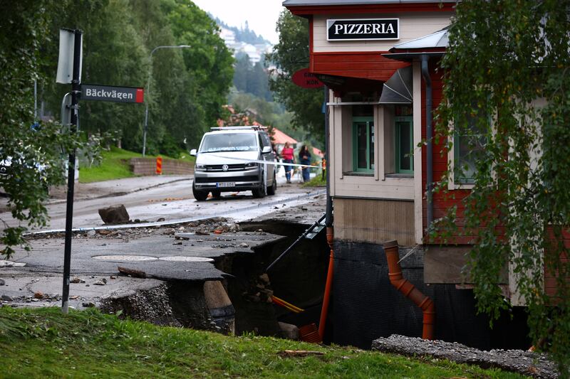 A section of road was swept away after the Susa river overflowed in Are, northern Sweden. Reuters