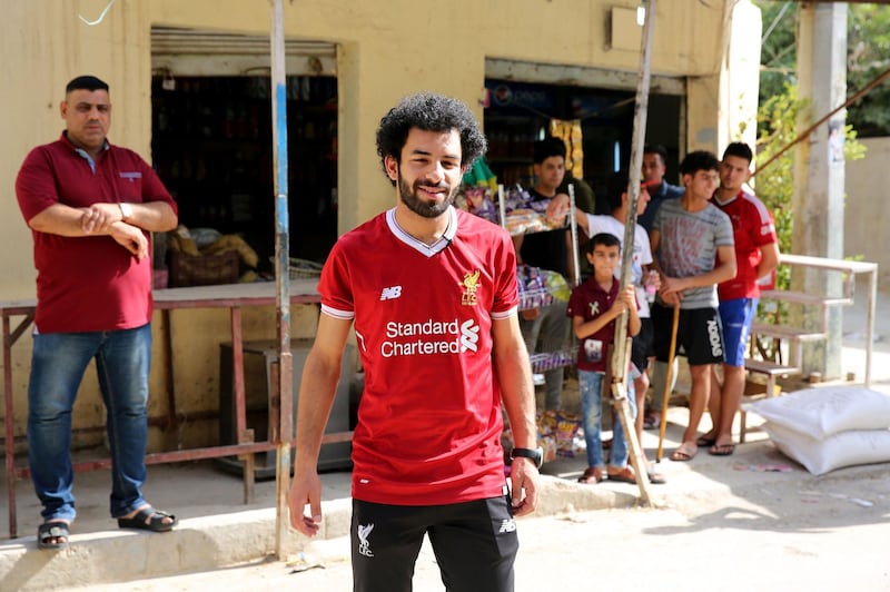Iraqi footballer Hussein Ali paid $40 for the official Liverpool shirt after Mohamed Salah's successful first season in the Premier League. Sabah Arar / AFP