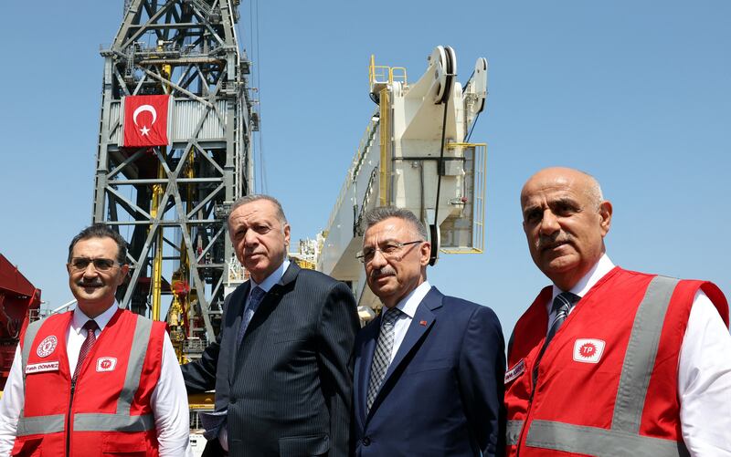 Recep Tayyip Erdogan poses with cabinet colleagues onboard Turkey's new drill ship Abdulhamid Han at Tasucu port in the Mediterranean city of Mersin in August. Reuters
