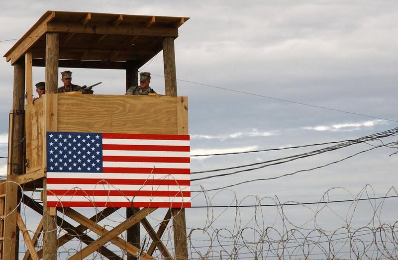 A watchtower security team at Camp X-Ray in Guantanamo Bay, Cuba, pictured in 2002. In his new book, The Value of Violence, the political scientist Benjamin Ginsberg denounces the US prison system and argues that ruling powers such as America maintain authority through the systematic violence of laws and incarceration. Shane T McCoy / Getty Images