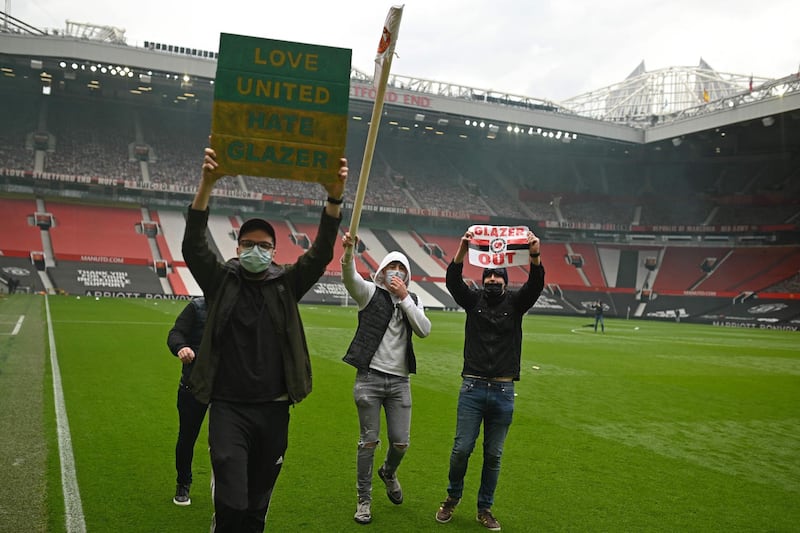 Supporters protest against Manchester United's owners at Old Trafford. AFP