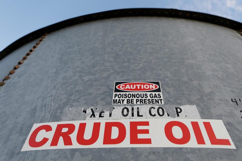 FILE PHOTO: A sticker reads crude oil on the side of a storage tank in the Permian Basin in Mentone, Loving County, Texas, U.S. November 22, 2019. Picture taken November 22, 2019.   REUTERS/Angus Mordant/File Photo