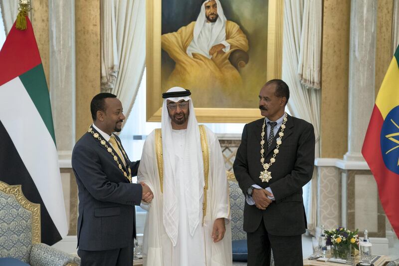 ABU DHABI, UNITED ARAB EMIRATES - July 24, 2018: HH Sheikh Mohamed bin Zayed Al Nahyan Crown Prince of Abu Dhabi Deputy Supreme Commander of the UAE Armed Forces (C), presents a Zayed Medal to HE Dr Abiy Ahmed, Prime Minister of Ethiopia (L) and HE Isaias Afwerki, President of Eritrea (R), during a reception at the Presidential Palace. 

( Hamad Al Kaabi / Crown Prince Court - Abu Dhabi )
---