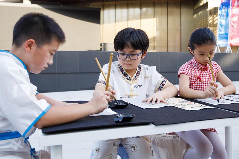 Children take part in arts and cultural activities at the China pavilion.