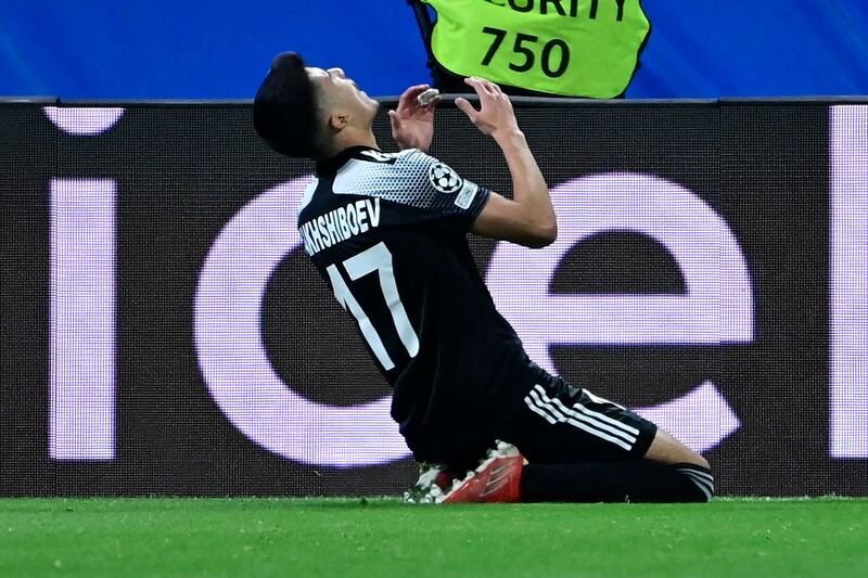 Jasurbek Yakhshiboev celebrates his goal. AFP
