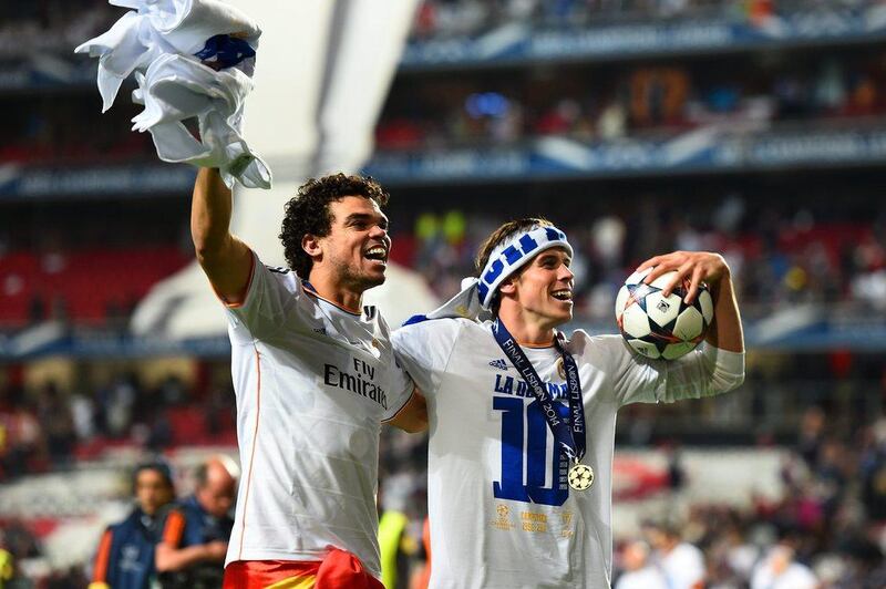 Pepe and Gareth Bale of Real Madrid celebrate victory in the Saturday's Champions League final. Laurence Griffiths / Getty Images / May 24, 2014