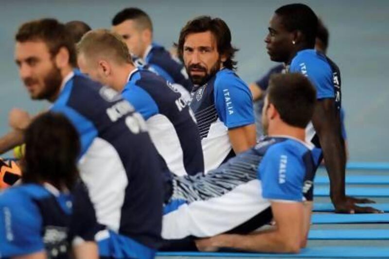 Andrea Pirlo, centre, XXXXX. Nicolas Tanner / AP Photo