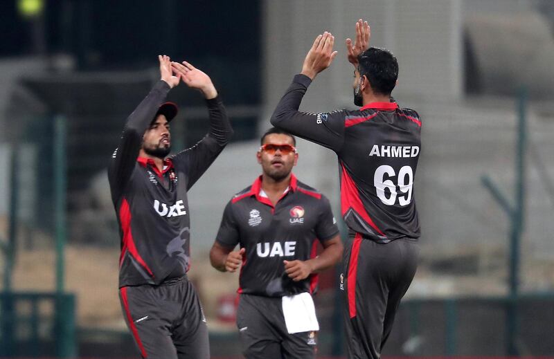ABU DHABI , UNITED ARAB EMIRATES , October 19  – 2019 :- Ahmed Raza of UAE ( right ) celebrating after taking the wicket of Andrew Balbirnie  during the World Cup T20 Qualifiers between UAE v Ireland held at Zayed Cricket Stadium in Abu Dhabi.  ( Pawan Singh / The National )  For Sports. Story by Amith