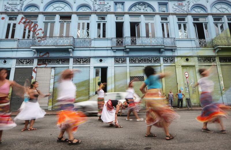 Dancers from the traditional Brazilian folkloric performance group Rio Maracatu are blurred while performing during their first pre-Carnival street practice in Rio de Janeiro, Brazil. In spite of hosting the Rio 2016 Olympic Games, the country’s economy remains mired in a deep recession while the Brazilian currency has tumbled following the election of US president-elect Donald Trump. While Carnival does not commence until February, preparations are already well underway in Rio, which holds what is considered the world’s largest carnival. Mario Tama / Getty Images