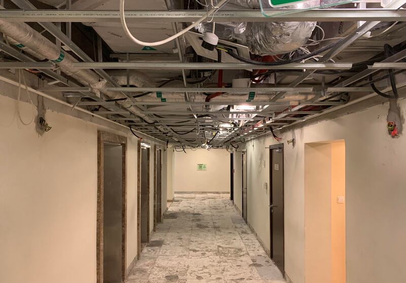 Ceiling and floor panels outside the apartments have been removed. 