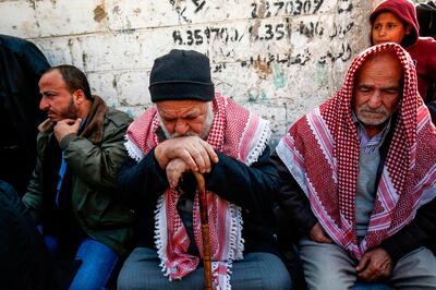 Relatives of 16-year-old Palestinian Mohamed al-Jahjuh mourn during his funeral in Gaza City on December 22, 2018. Al-Jahjuh died the day before by Israeli fire during protests and clashes along the Gaza border with Israel, health officials in the Hamas-run enclave said. / AFP / SAID KHATIB
