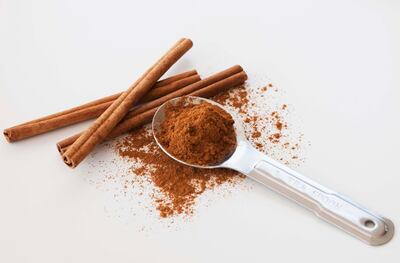 Studio shot of cinnamon stick and cinnamon powder. Getty Images