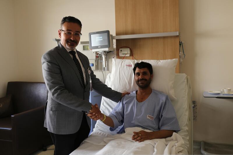Dr Walid Shaker, head of cardiac surgery at Burjeel Hospital, visits patient Mohamed Riaz after he underwent cardiac freezing surgery to cure an irregular heartbeat. Courtesy Burjeel Hospital 