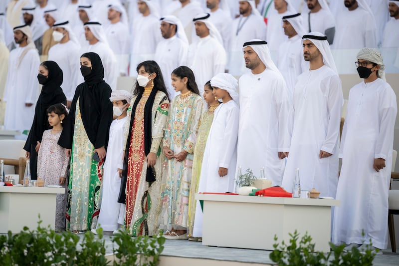 Sheikha Salama bint Mohamed, Sheikha Salama bint Theyab, Sheikha Hassa bint Mohamed, Sheikh Zayed bin Mohamed, Sheikha Fatima bint Mohamed, Sheikha Shamma bint Khaled, Sheikha Salama bint Khaled, Sheikh Mohamed bin Khaled, Sheikh Mohamed bin Hamad, Private Affairs Adviser in the Presidential Court, Sheikh Hamdan bin Mohamed and Sheikh Tahnoon bin Mohamed stand for the national anthem. Rashed Al Mansoori /  Presidential Court