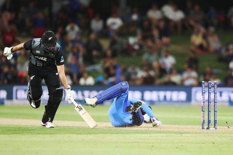 New Zealand’s Tom Bruce is run out by KL Rahul on Sunday. AFP