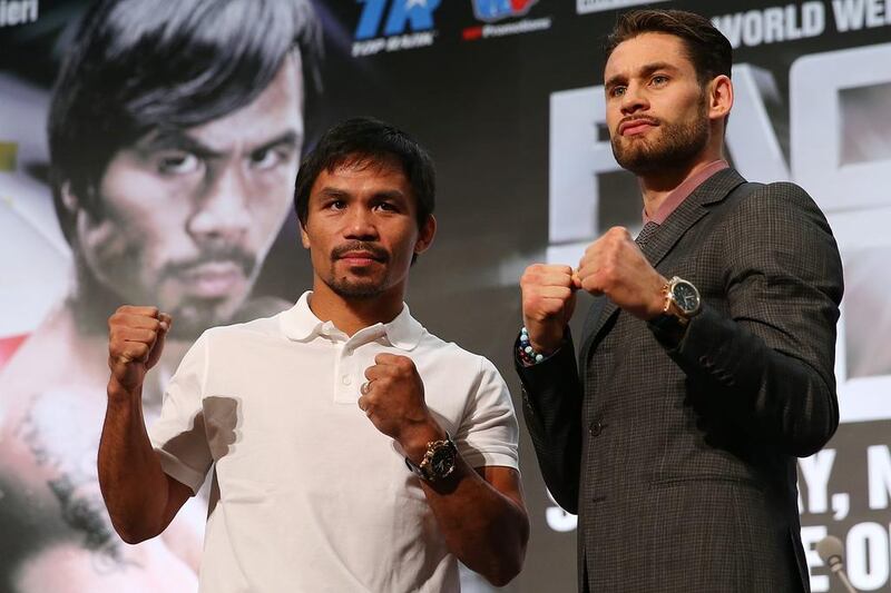 Manny Pacquiao, left, and trainer Freddie Roach are buying into the ‘Rocky-like’ claims of Chris Algieri, right. Chris Hyde / Getty Images

