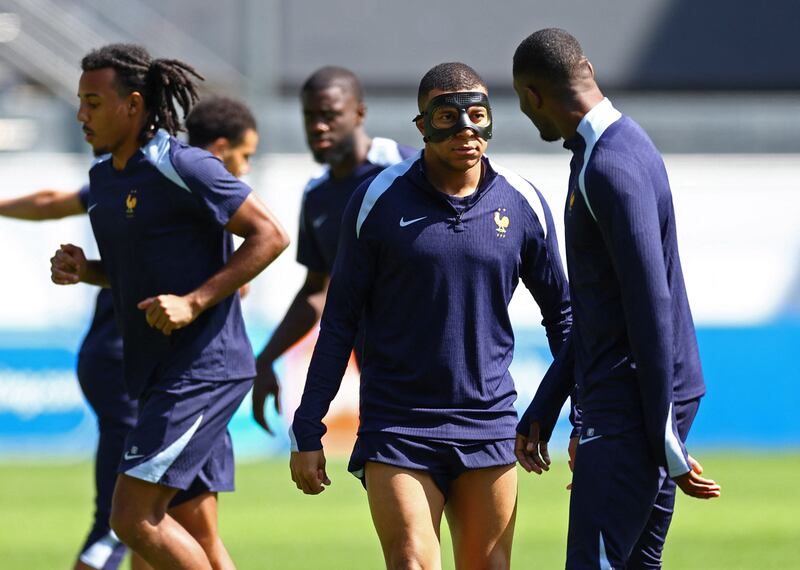 Kylian Mbappe with teammates in training on Monday. Reuters 