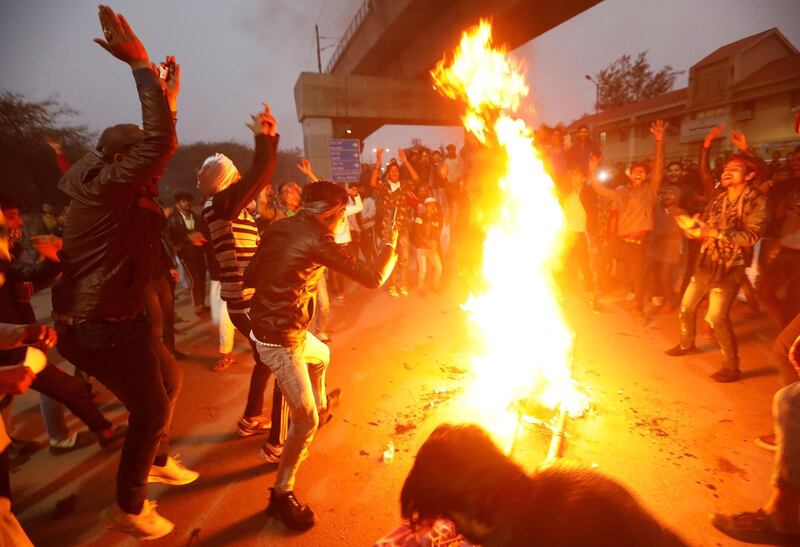 Demonstrators burn an effigy depicting Prime Minister Narendra Modi in New Delhi. Reuters