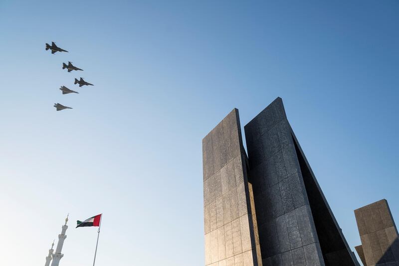 ABU DHABI, UNITED ARAB EMIRATES - November 30, 2017: Military jets perform a flyby during a Commemoration Day ceremony at Wahat Al Karama, a memorial dedicated to the memory of UAE’s National Heroes in honour of their sacrifice and in recognition of their heroism.
( Hamad Al Kaabi / Crown Prince Court - Abu Dhabi )
---