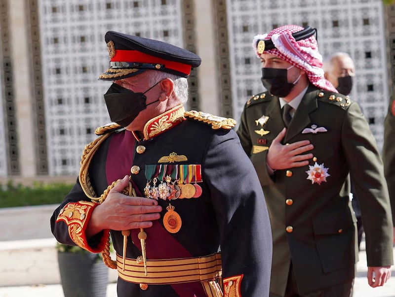 Jordan's King Abdullah II arrives for the inauguration of the 19th Parliament’s non-ordinary session along with Crown Prince Hussein, in Amman on December 10, 2020. The Royal Hashemite Court via AP