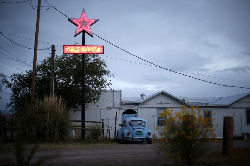 A motel displays a neon vacancy sign in Truth or Consequences, New Mexico. The people of Truth or Consequences are sensing a shift in confidence as the countdown nears for the inaugural space flight from the taxpayer-funded Spaceport America. Lucy Nicholson / Reuters