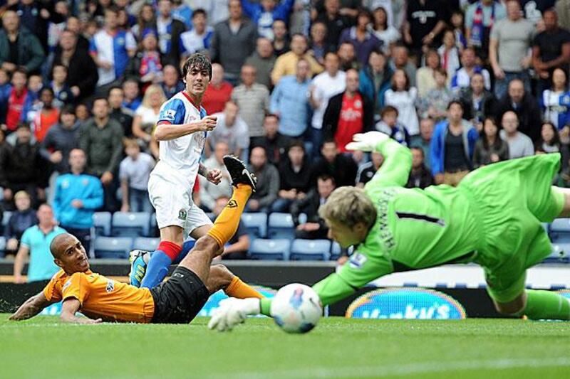 Blackburn's Mauro Formica slots past Wayne Hennessey, the Wolverhampton Wanderers goalkeeper, to score on debut at Ewood Park.

Clive Brunskill / Getty Images