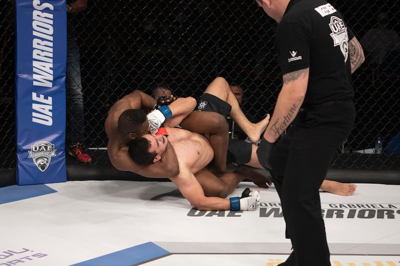 Emirati Rashed Dawood made a sensational MMA debut. Here he is seen with a rear naked choke on Uzbek Otabek Kadirov. Courtesy Palms Sports