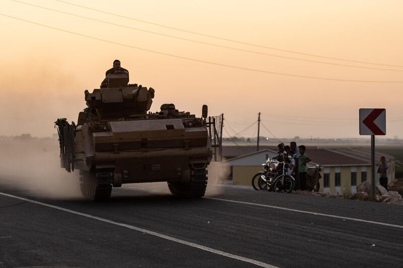 AKCAKALE, TURKEY - OCTOBER 09: A Turkish armored vehicle prepare to cross the border into Syria on October 09, 2019 in Akcakale, Turkey. The military action is part of a campaign to extend Turkish control of more of northern Syria, a large swath of which is currently held by Syrian Kurds, whom Turkey regards as a threat. U.S. President Donald Trump granted tacit American approval to this campaign, withdrawing his country's troops from several Syrian outposts near the Turkish border. (Photo by Burak Kara/Getty Images)