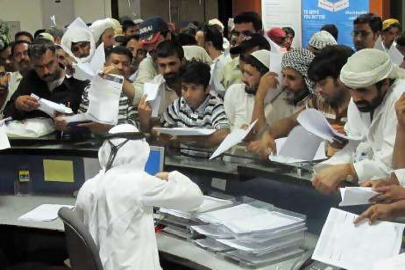 Daman offices in Abu Dhabi and Al Ain (this is Al Ain) were packed with people yesterday as thousands rushed to avoid a Dh300 fine for failing to have valid health insurance.

Essam Al Ghalib / The National