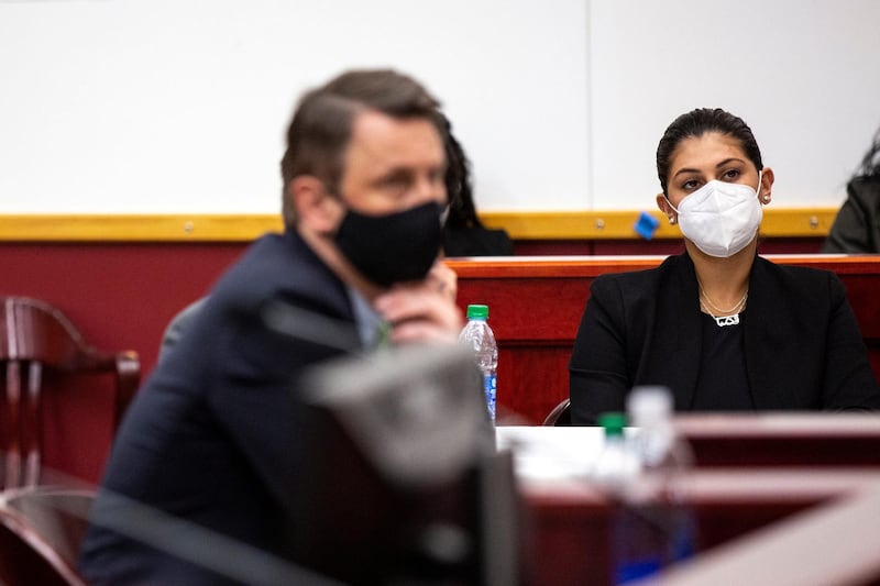 Des Moines Register Reporter Andrea Sahouri listens to closing statements in her trial, next to Defending Attorney Nicholas Klinefeldt, after being arrested while covering a protest last summer, at the Drake University Legal Clinic in Des Moines, Iowa, U.S. March 10, 2021.   Kelsey Kremer/The Register/USA Today Network via REUTERS.  NO RESALES. NO ARCHIVES. MANDATORY CREDIT