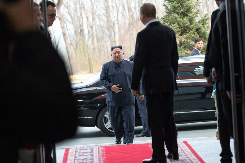 North Korea's leader Kim Jong-un steps out of his car.