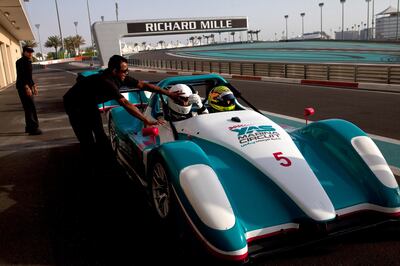 Abu Dhabi, United Arab Emirates, May 27, 2013:    A man sits in a Supersport SST while taking part in a passenger hot-lap experience during a corporate open day at the Yas Marina Circuit in Abu Dhabi on May 27, 2013. Christopher Pike / The National\

