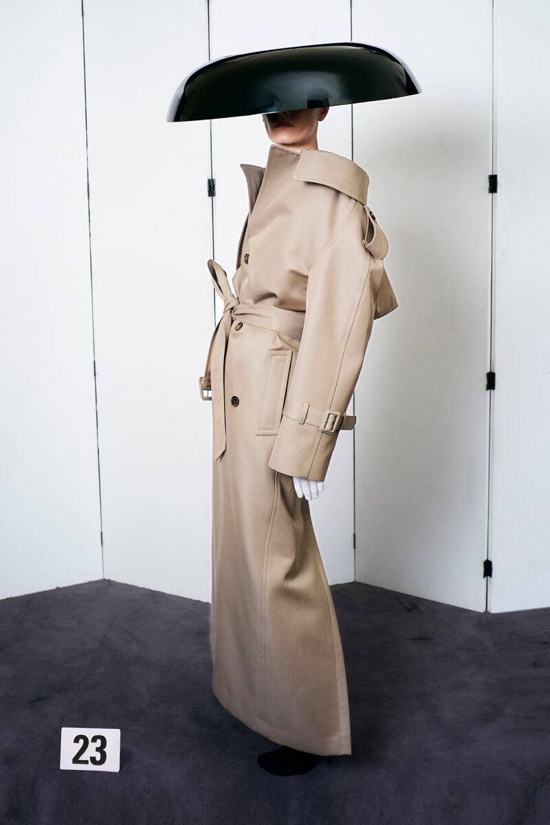 A trench coat was recut into an elegant Balenciaga dress with a wide neckline.