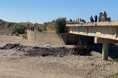 The wreckage of a burnt passenger bus in Lasbela district of Pakistan's Balochistan province on January 29. AFP
