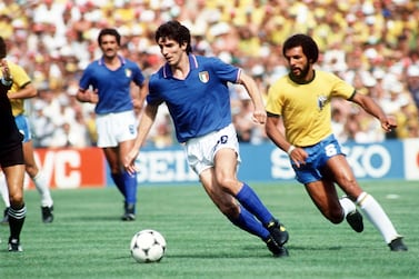 Italy's Paolo Rossi gets away from Brazil's Junior during the 1982 World Cup finals. Action Images
