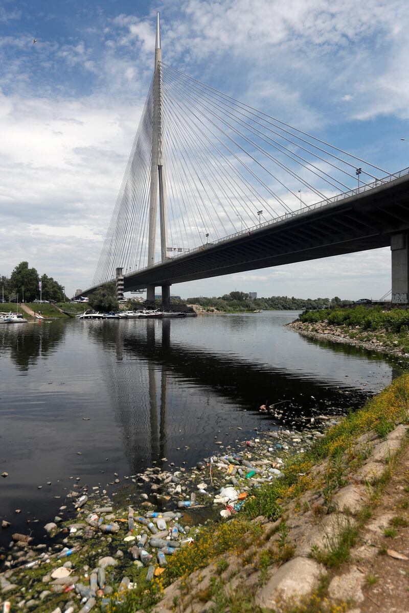 Dumped plastic bottles and barrels on the bank of the river Sava on World Environment Day, in Belgrade, Serbia.  AP
