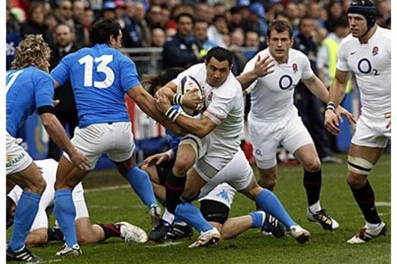 England's Riki Flutey tries to find a way through the Italian defence in Rome.