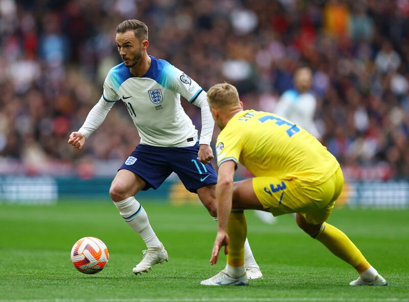 England's James Maddison takes on Ukraine's Oleksandr Svatok. Reuters 