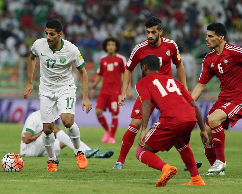 UAE’s Abdelaziz Sanqour, No 14 , and Mohanad Salem, right, defend Saudi Arabia’s Taiseer Al Jassam on Thursday in Jeddah. Fayez Nureldine / AFP

