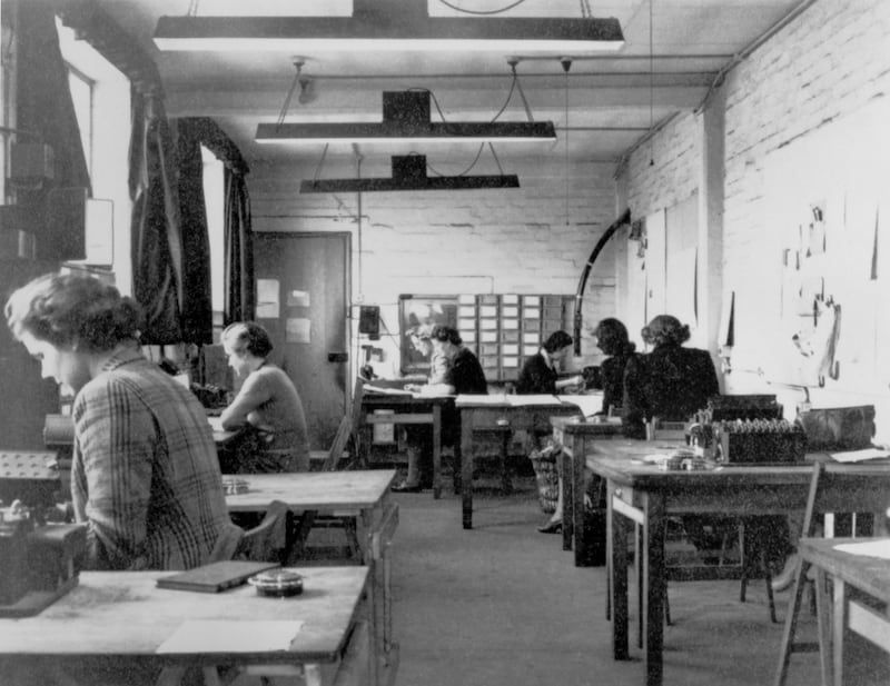 The machine room in hut six of Bletchley Park in 1943. Cryptographers at the centre intercepted and deciphered top-secret military communiques between Hitler and his armed forces