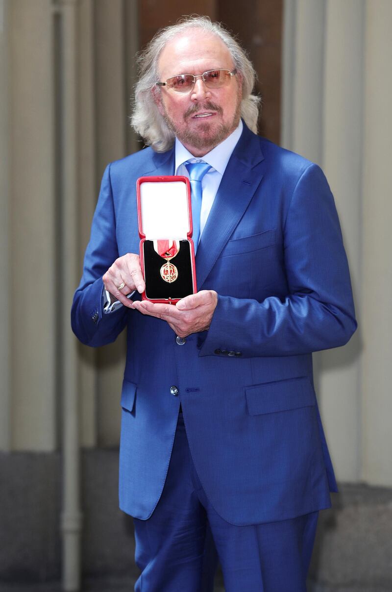 Singer and songwriter Barry Gibb, poses after being Knighted by the Britain's Prince Charles at Buckingham Palace, London, June 26, 2018. Steve Parsons/Pool via Reuters
