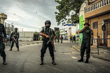 Sri Lankan security forces enforce a cordon while a bomb disposal unit works near the St Anthony Church, April 22, 2019. Jack Moore / The National.