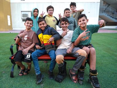 Yazen Abu Hasira (front row, second left) with fellow Palestinian children at Emirates Humanitarian City. Victor Besa / The National
