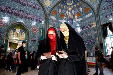 Iranian women check their ID papers to vote in the presidential election, in Tehran, Iran. Conservative cleric and head of Iran’s judiciary Ebrahim Raisi was victorious. EPA