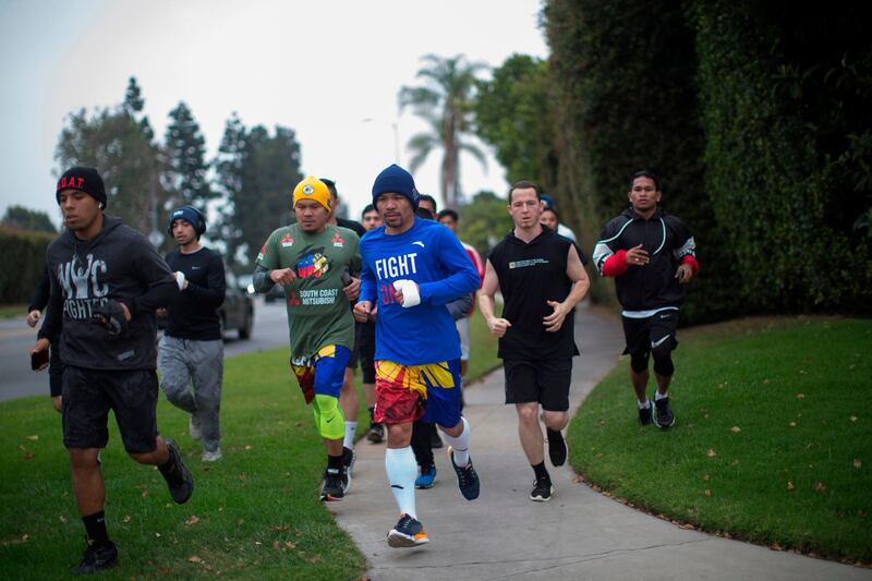Manny Pacquiao jogs in the morning with fans and friends in Los Angeles. AFP